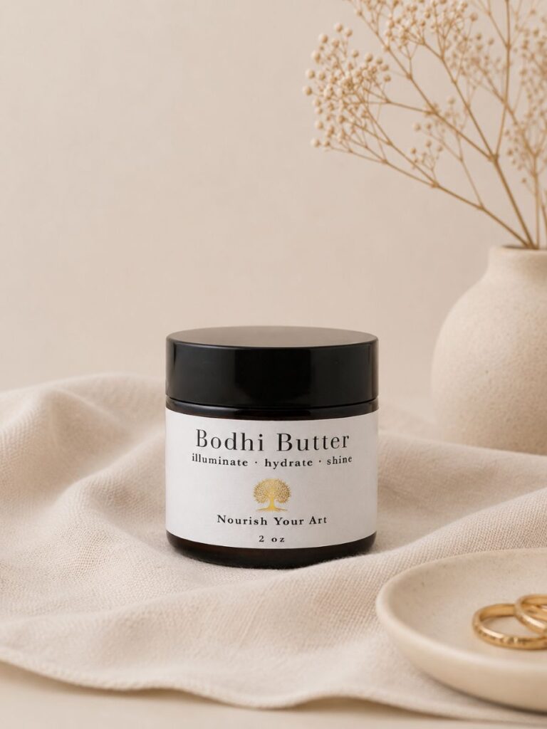 Bodhi Butter botanical body butter in a 2 oz jar on soft neutral fabric