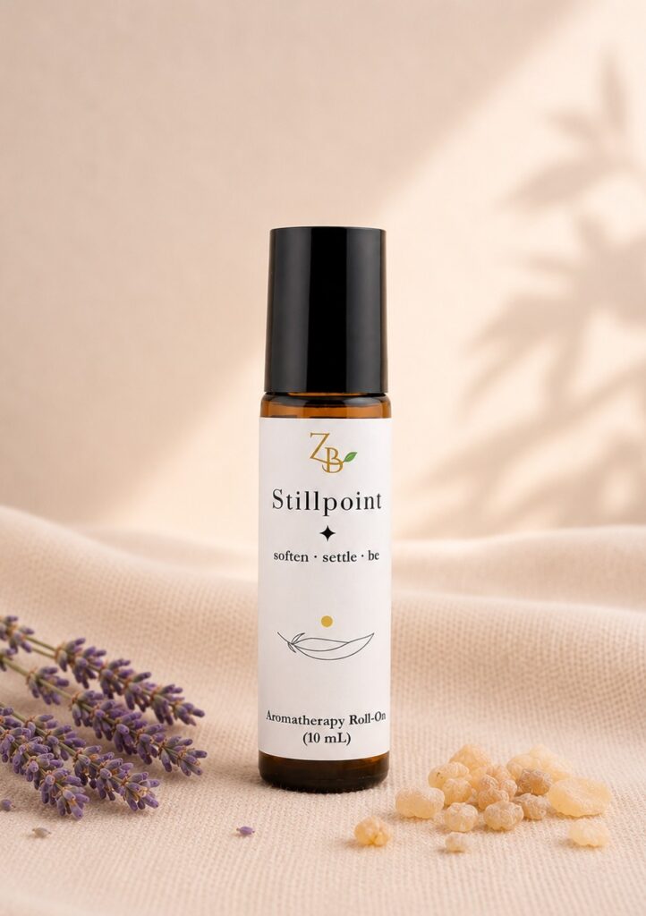 Stillpoint aromatherapy roll-on with lavender and frankincense beside dried lavender and frankincense resin