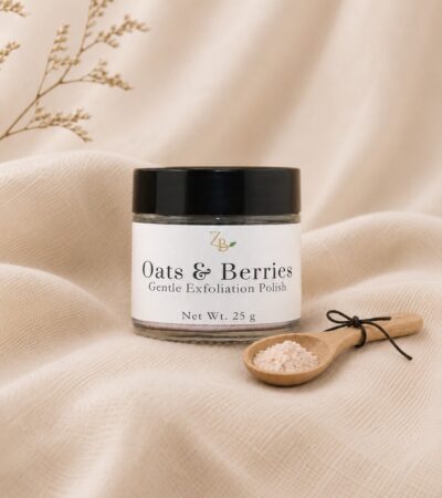 amber jar with black lid, small wooden spoon with exfoliation powder in it
