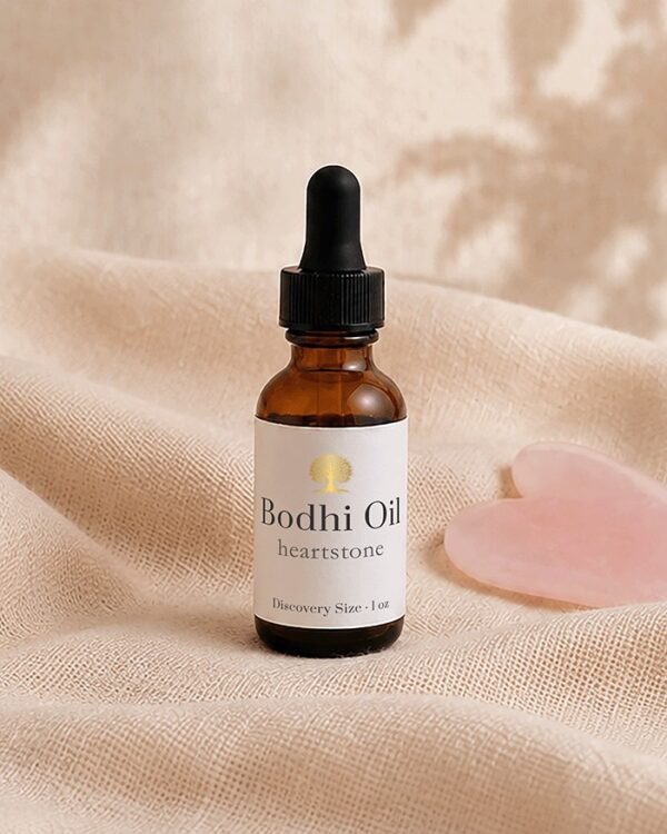 amber bottle with heart gua sha stone