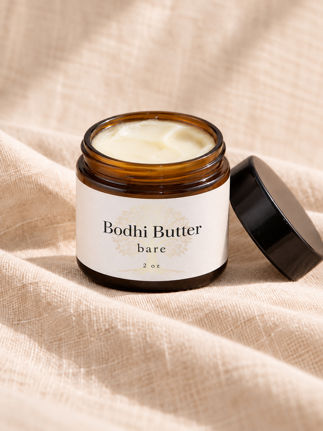open amber jar of bare body butter