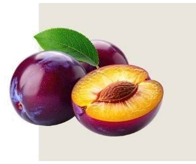 Whole and halved purple plums with a green leaf, showing the pit